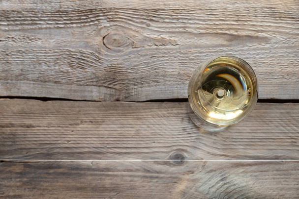 Glass of white wine on the wooden background - Zdjęcie, obraz