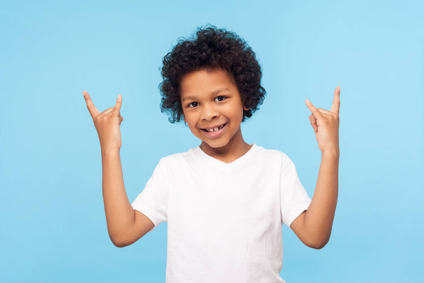 Let's rock! Portrait of joyful funky little boy with curly hair  - Φωτογραφία, εικόνα