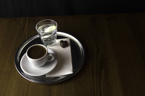 lemon juice with a cup of coffee and chocolate - Φωτογραφία, εικόνα