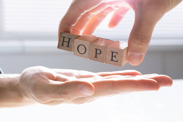 Close-up Of Person's Hand Giving Hope To Other Person - Photo, image