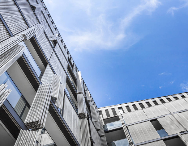 Modern building against stunning sky. Bottom view. - Foto, Imagen