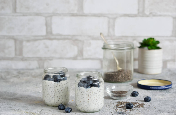 Chia pudding with blueberries for breakfast. Stone background. - Photo, Image
