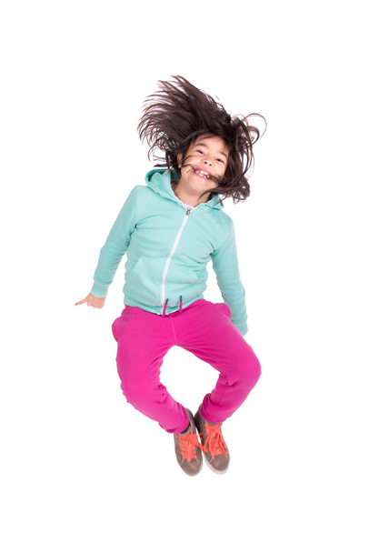 Young girl jumping isolated in white - Photo, image