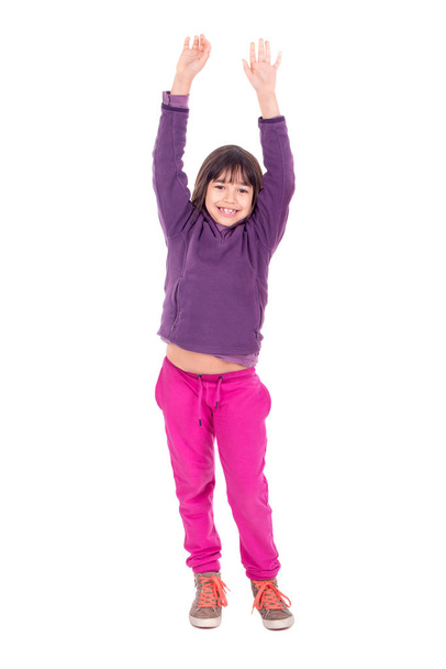 Young girl posing with raised arms isolated in white - Foto, immagini