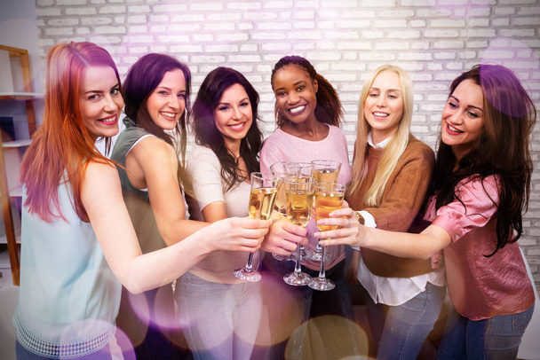 Smiling Portrait Of Women Celebrating Bachelorette Party Of The Bride By Clinking Champagne Glasses - Foto, afbeelding
