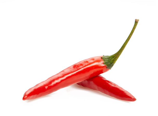 Red hot chili peppers isolated on a white background. - 写真・画像