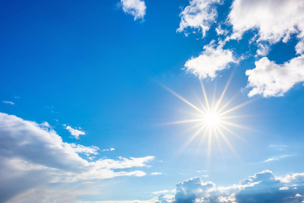Summer background, wonderful blue sky with bright sun and clouds - Valokuva, kuva