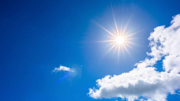 Summer background, wonderful blue sky with bright sun and clouds - Фото, зображення