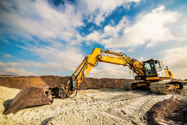 Big excavator in construction site - Fotoğraf, Görsel