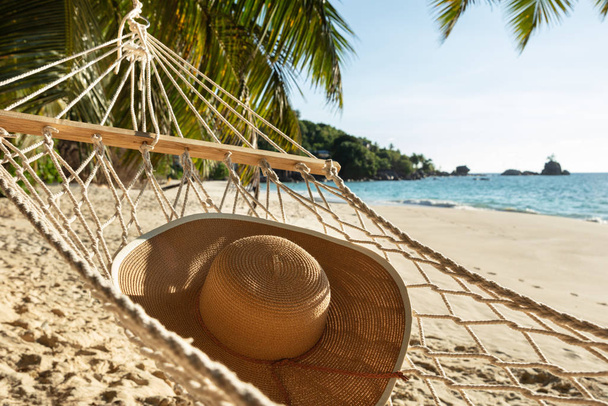 Close-up Of Sun Hat On Hammock Over The Sand At Beach - Photo, Image