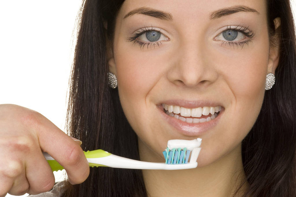young woman brushing teeth - Foto, imagen