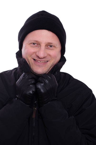 man with gloves and cap smiles - Fotografie, Obrázek