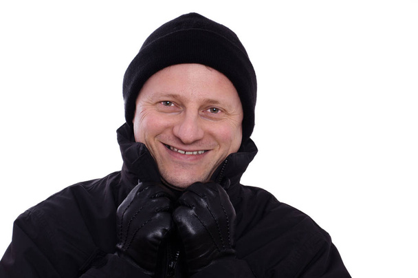 despite cold man laughing with hat and gloves - Фото, зображення