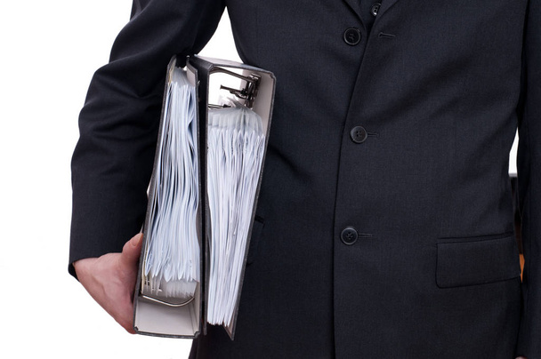 a man in suit holding two folders under his arm - Photo, Image