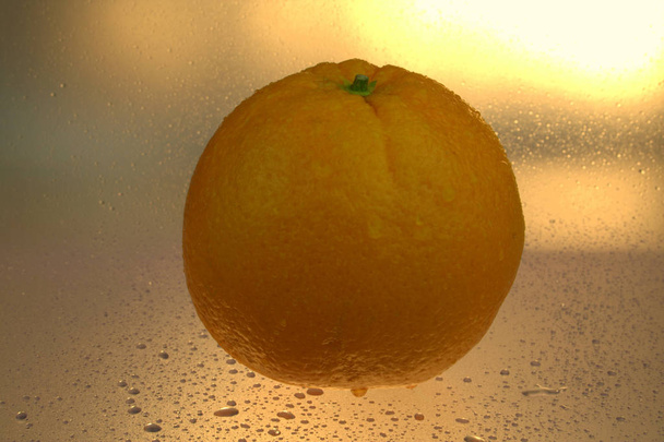 orange fruit on the ice - Φωτογραφία, εικόνα