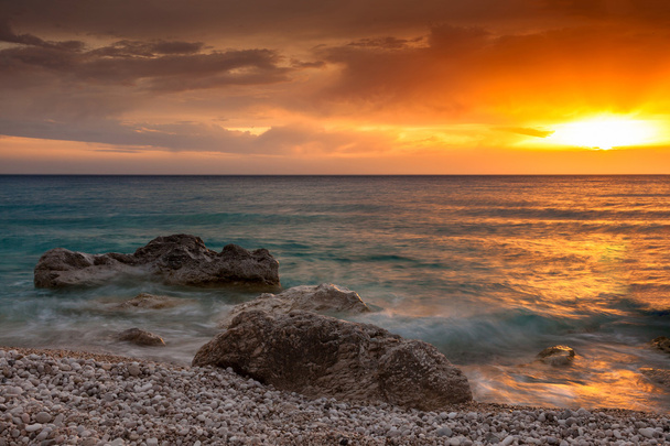 puesta de sol y playa
 - Foto, imagen
