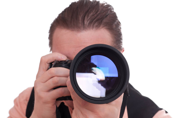 a male photographer with a large telephoto lens - Foto, Bild