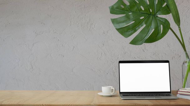 Közelről kilátás otthoni iroda üres képernyős laptop, dekorációk és kávéscsésze fehér asztal fehér fal háttér   - Fotó, kép