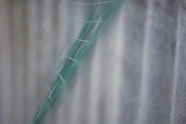 зеленая сетка забор волна крупным планом, макрофото
 - Фото, изображение