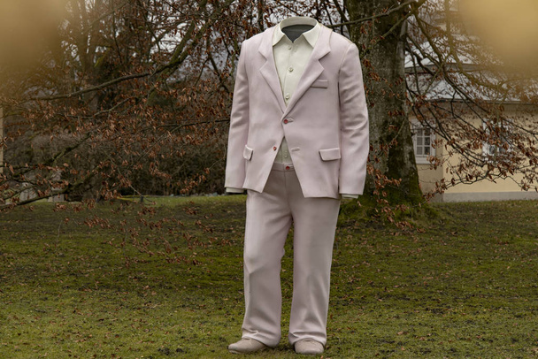 sculpture classic suit cloth funny decor object in yard - Фото, изображение
