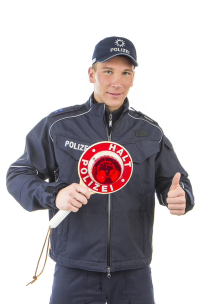 young man in red uniform with a gun - Zdjęcie, obraz