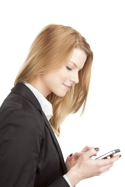  young blonde woman business look with smartphone - Foto, imagen
