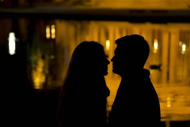 silhouette of a young couple in love - Фото, зображення