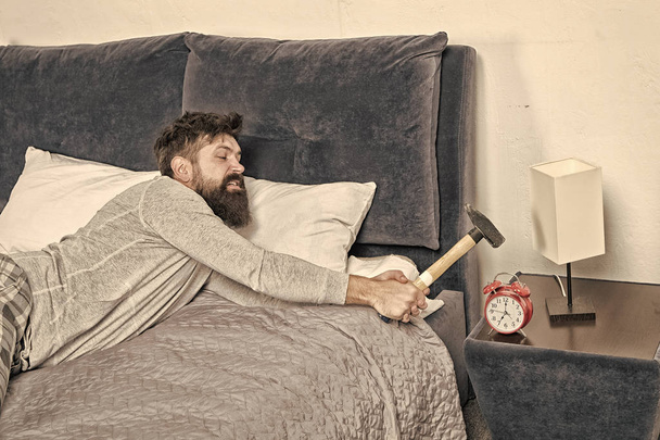 going crazy. Healthy sleep concept. need more relax in bed. bearded man hipster want to sleep. hate noise of alarm clock. Stages of sleep. Man awake unhappy with alarm clock ringing. Sleep longer - Foto, afbeelding