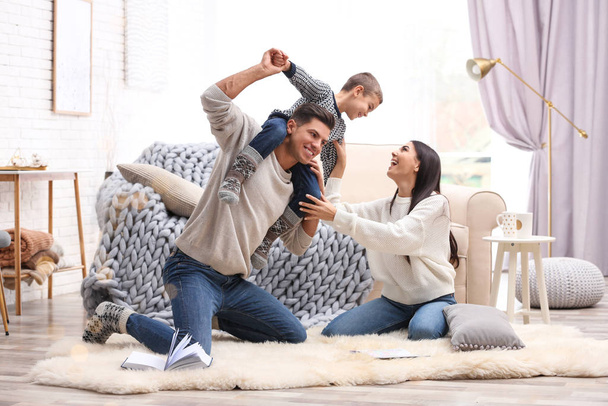Happy family with little son having fun at home. Winter vacation - Φωτογραφία, εικόνα