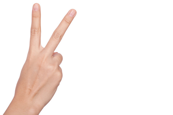 Hand with two fingers up in the peace or victory symbol - Foto, imagen