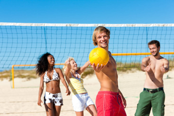 friends playing beach volleyball - Fotó, kép
