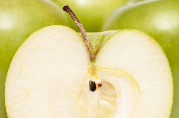 slice of a green golden delicious apple - Foto, Imagem