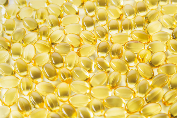 close up view, evening primrose oil capsules. Alternative medicine and health care concept. - Фото, изображение