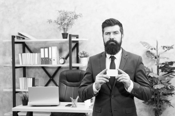 Easy and quick payment. Bank card. Financial support. Bearded hipster top manager hold card. Banking services. Guy formal suit stand in office. Businessman hold blank card. Finance and accounting - Foto, immagini