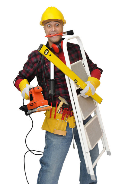 Construction worker stressed with lots of tools isolated in white - Foto, immagini