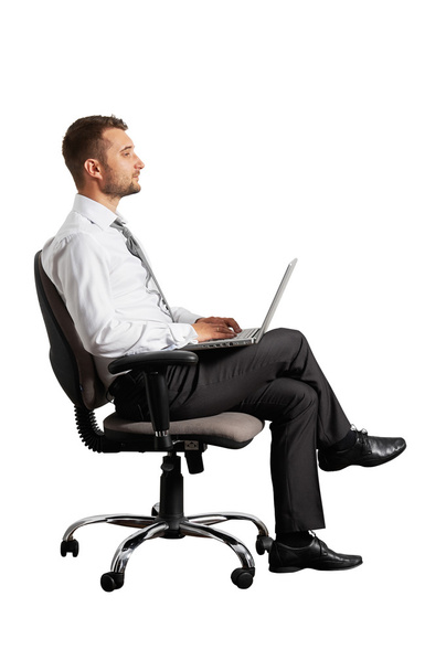 Nuori liikemies kannettavan tietokoneen kanssa
 - Valokuva, kuva