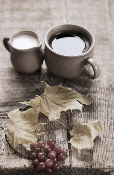 Artwork in retro style, cup of coffee, milk jug, yellow leaves, - Photo, Image