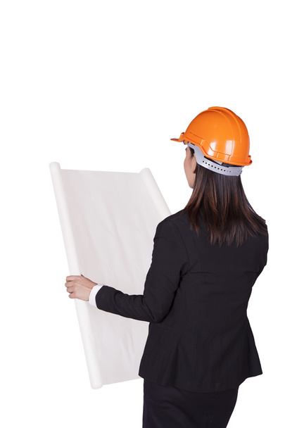 Engineer woman in an orange helmet holding a plan for the project - 写真・画像