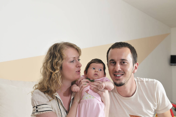 indoor portrait with happy young family and  cute little babby - Photo, Image