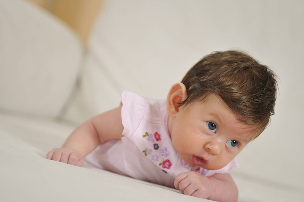 cute baby girl lying on the bed - Photo, Image
