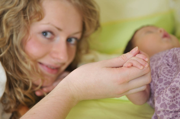 beautiful young mother hold small children hand - Φωτογραφία, εικόνα