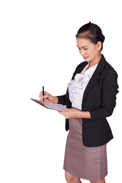 Businesswoman writes documents - 写真・画像