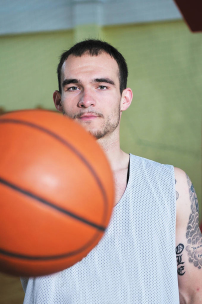 one basket ball game player standing in sport gym with ball - Fotografie, Obrázek