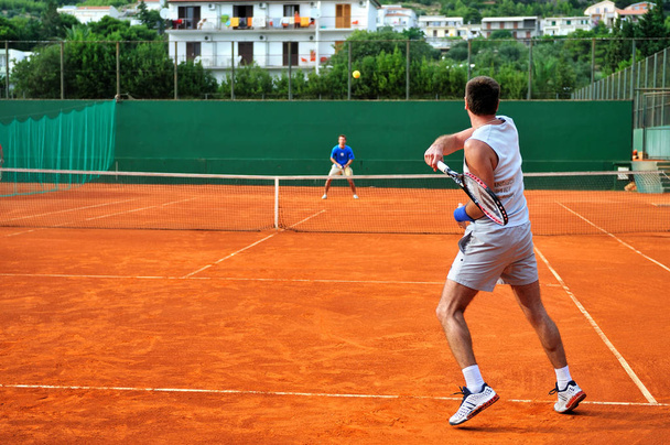 One Man play tennis on outdoor court - Фото, изображение