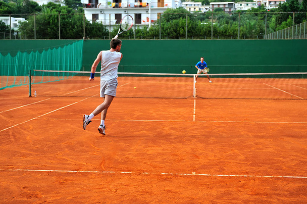 One Man play tennis on outdoor court - 写真・画像