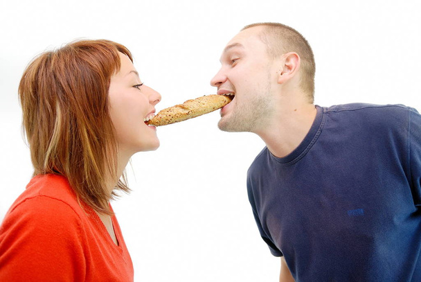 happy couple eating croissant - Zdjęcie, obraz