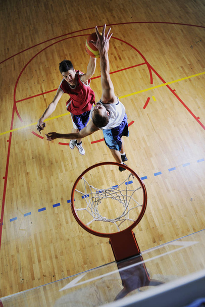 competition cencept with people who playing and exercise  basketball sport  in school gym - Photo, image