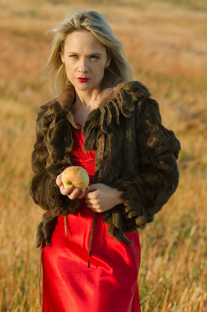 Young pretty woman holding apple - Фото, зображення