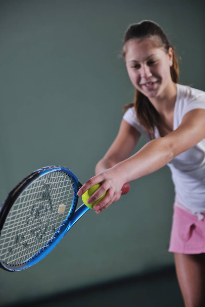 young girl exercise tennis sport indoor - Foto, afbeelding