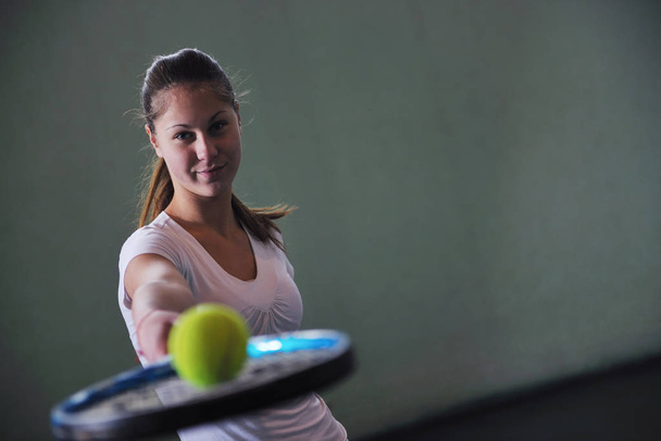 one woman playing tennis sport indoor - 写真・画像